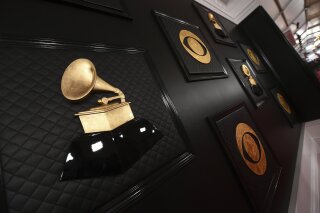 FILE - The red carpet appears prior to the start of the 62nd annual Grammy Awards in Los Angeles on Jan. 26, 2020. The Grammys are changing the name of its best world music album category to the best global music album, an attempt to find “a more relevant, modern and inclusive term.” The Recording Academy said the new name “symbolizes a departure from the connotations of colonialism.” The step comes some five months after the Academy made changes to several Grammy Awards categories, including renaming the best urban contemporary album category as best progressive R&B album.  (Photo by Jordan Strauss/Invision/AP, File)