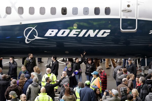 FILE- In this Feb. 5, 2018, file photo a Boeing 737 MAX 7 is displayed during a debut for employees and media of the new jet in Renton, Wash. U.S. regulators are warning airlines to limit the use of an anti-icing system on Boeing 737 Max jets in dry air to avoid overheating engine-housing parts, which could cause them to break away from the plane. (AP Photo/Elaine Thompson, File)
