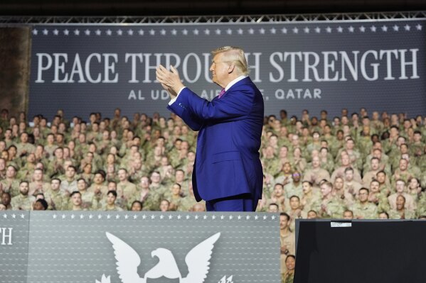 President Donald Trump applauds on stage at the Al Udeid Air Base, Thursday, May 15, 2025, in Doha, Qatar. (AP Photo/Alex Brandon)