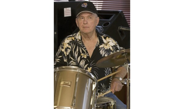 FILE - Legendary Sun Records drummer J.M. Van Eaton practices in Tuscumbia, Ala., July 28, 2010. Van Eaton, a pioneering rock ‘n’ roll drummer who played behind the likes of Jerry Lee Lewis and Billy Lee Riley at Sun Records in Memphis, Tenn., died Friday, Feb. 9, 2024, at age 86, a family member said. (Matt McKean/The TimesDaily via AP, File)