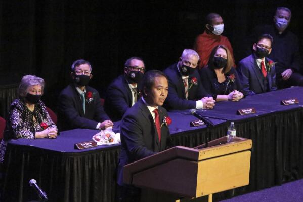Mayor Sokhary Chau addresses the assembly during the Lowell City Council swearing-in ceremony, Monday, Jan. 3, 2022, in Lowell, Mass., held at Lowell Memorial Auditorium due to the COVID-19 pandemic. Chau, a refugee who survived the Khmer Rouge’s bloody regime, has become the city’s first mayor of color and the first Cambodian American mayor in the United States. (Julia Malakie/The Lowell Sun via AP)