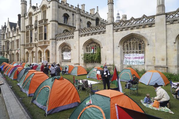 Students protest against the war in Gaza, at an encampment on the grounds of Cambridge University, England, Tuesday May 7, 2024. Students in the UK, including in Leeds, Newcastle and Bristol, have set up tents outside university buildings, replicating the nationwide campus demonstrations which began in the US last month. (Joe Giddens/PA via AP)
