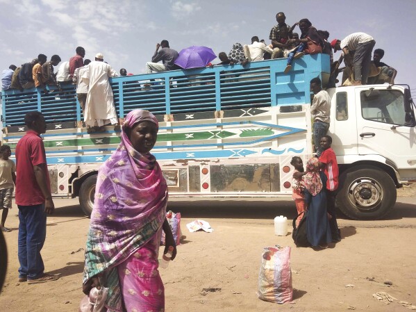 FILE - People board a truck as they leave Khartoum, Sudan, on June 19, 2023. The U.N. human rights office said in a new report Friday, Feb. 23, 2024, that scores of people, including children, have been subjected to rape and other forms of sexual violence in the ongoinng conflict in Sudan, assaults that may amount to war crimes. (AP Photo, File)