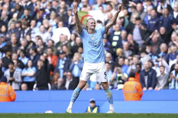 Manchester City's Erling Haaland celebrates scoring his side's third goal during the English Premier League soccer match between Manchester City and Leicester City at Etihad Stadium in Manchester, England, Saturday, April 15, 2023. (Nick Potts/PA via AP)