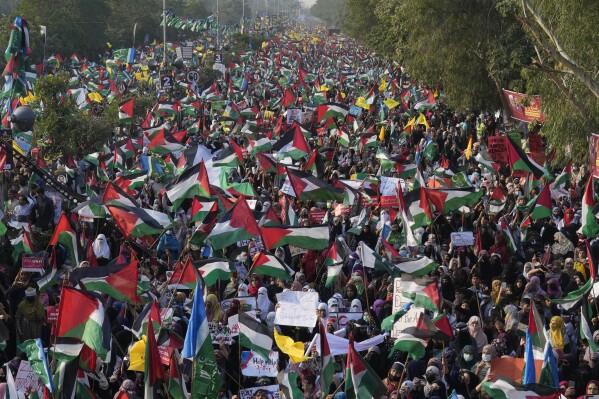 Thousands of supporters from Pakistan’s main religious political party take part in a rally against the Israeli airstrikes on Gaza to show solidarity with Palestinian people, in Lahore, Pakistan, Sunday, Nov. 19, 2023. (AP Photo/K.M. Chaudary)