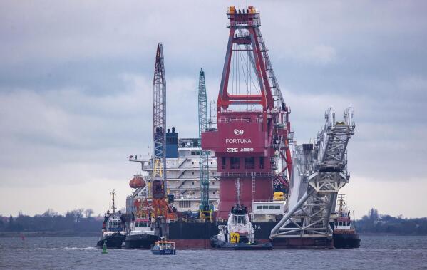 FILE - File photo shows tugboats get into position on the Russian pipe-laying vessel "Fortuna" in the port of Wismar, Germany, Jan.14, 2021. The special vessel is being used for construction work on the German-Russian Nord Stream 2 gas pipeline in the Baltic Sea.U.S. President Joe Biden says that if Russia launches an invasion of Ukraine, the Nord Stream 2 gas pipeline is history. The 10 billion-euro undersea pipeline from Russia direct to Germany has become a major issue in attempts by Western governments to deter a Russian military move against its neighbor. (Jens Buettner/dpa via AP, File)