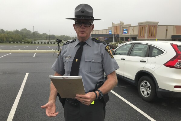 State police spokesman Trooper David Beohm addresses the media in Morgantown Pa. after the capture of nine escapees from the nearby Abraxas Academy juvenile facility Monday, Sept. 18 2023. (Steven Henshaw/Reading Eagle via AP)