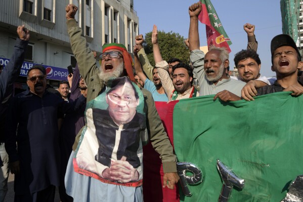 Supporters of Pakistan's Former Prime Minister Imran Khan's party 'Pakistan Tehreek-e-Insaf' chant slogans during a protest against alleged vote-rigging in some constituencies in the parliamentary elections, in Karachi, Pakistan, Sunday, Feb. 11, 2024. (APPhoto/Fareed Khan)