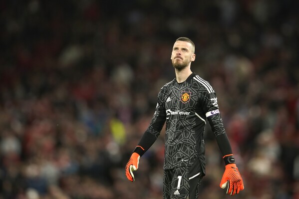 Manchester United's goalkeeper David de Gea reacts after the English Premier League soccer match between Manchester United and Chelsea at the Old Trafford stadium in Manchester, England, Thursday, May 25, 2023. Veteran goalkeeper David de Gea has announced he is leaving Manchester United as a free agent after 12 seasons at Old Trafford. The 32-year-old's contract with United expired at the end of June, with no new deal agreed despite talks that took place throughout the season. (AP Photo/Dave Thompson)