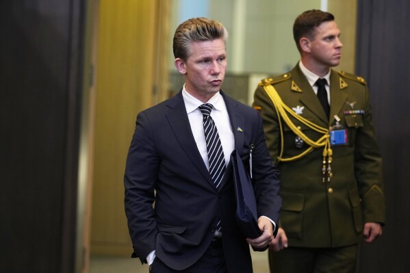 Sweden's Defense Minister Pal Jonson, left, arrives for a meeting of the NATO-Ukraine Council at NATO headquarters in Brussels, Wednesday, Oct. 11, 2023. Ukraine's President Volodymyr Zelenskyy and Ukraine's Defense Minister Rustem Umerov arrived at NATO for meetings with alliance defense ministers to further drum up support for Ukraine's fight against Russia. (AP Photo/Virginia Mayo)