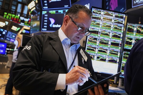 Trader Edward Curran works on the floor of the New York Stock Exchange on Wednesday, May 14, 2025 (AP Photo/Richard Drew)