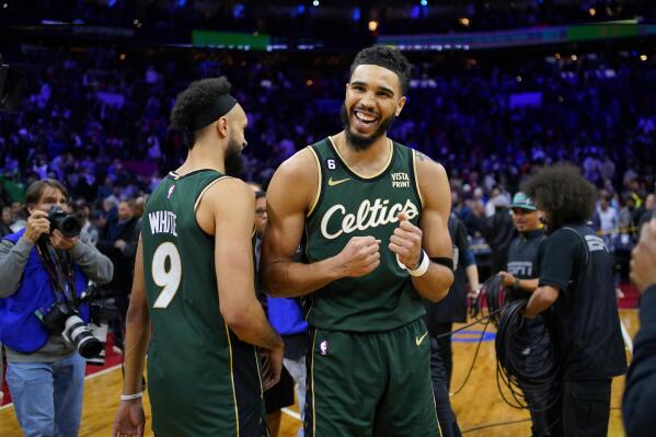 Boston Celtics' Jaylen Brown, right, goes up to shoot against Philadelphia  76ers' Paul Reed during the first half of Game 4 in an NBA basketball  Eastern Conference semifinals playoff series, Sunday, May