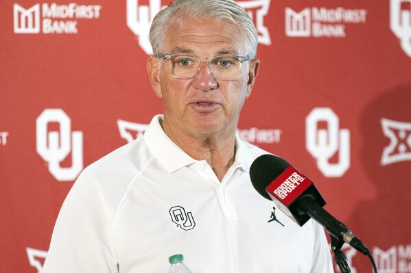 FILE - Oklahoma defensive coordinator Ted Roof speaks during an NCAA college football media day Aug. 1, 2023, in Norman, Okla. Oklahoma announced it has moved on from defensive coordinator and linebackers coach Roof. Oklahoma coach Brent Venables said in a news release that he told Roof he was being let go as defensive coordinator. Roof declined to stay on the staff in a different role. (AP Photo/Alonzo Adams, File)