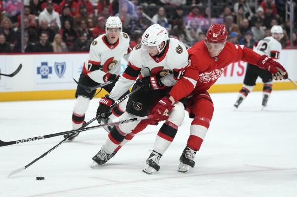 Detroit Red Wings left wing Elmer Soderblom (85) defends Ottawa Senators right wing Drake Batherson (19) in the second period of an NHL hockey game Saturday, Dec. 17, 2022, in Detroit. (AP Photo/Paul Sancya)