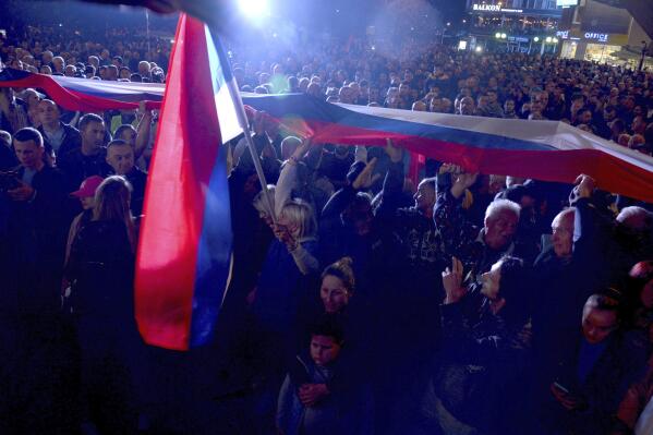 People protest against alleged election fraud in a general elections in the Bosnian town of Banja Luka, 240 kms northwest of Sarajevo, Sunday, Oct. 9, 2022. Thousands on Sunday rallied in Bosnia for the second time in a week, alleging that pro-Russian Bosnian Serb leader Milorad Dodik rigged a ballot during a general election in the Balkan country last weekend. (AP Photo/Radivoje Pavicic)