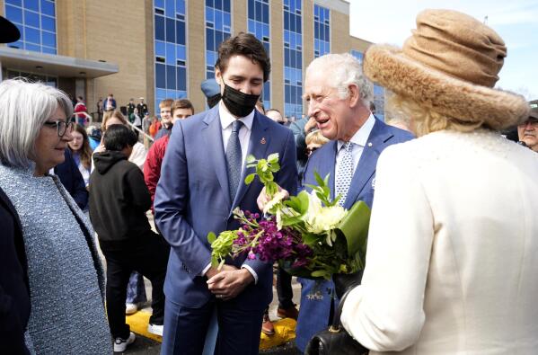 Prince Charles and Camilla, Duchess of Cornwall greet Canada's Gov.-Gen. Mary Simon as Prime Minister Justin Trudeau looks on, in St. John's, during the start a three-day Royal Canadian tour, Tuesday, May 17, 2022.  (Paul Chiasson/The Canadian Press via AP)