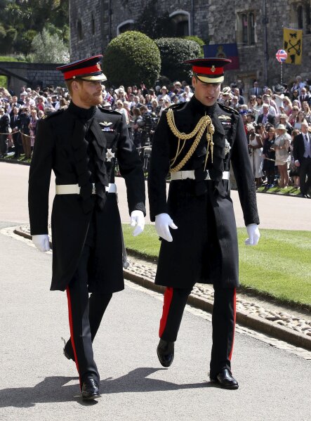 
              Britain's Prince Harry, left, and Prince William arrive for the wedding ceremony of Prince Harry and Meghan Markle at St. George's Chapel in Windsor Castle in Windsor, near London, England, Saturday, May 19, 2018. (Chris Radburn/pool photo via AP)
            