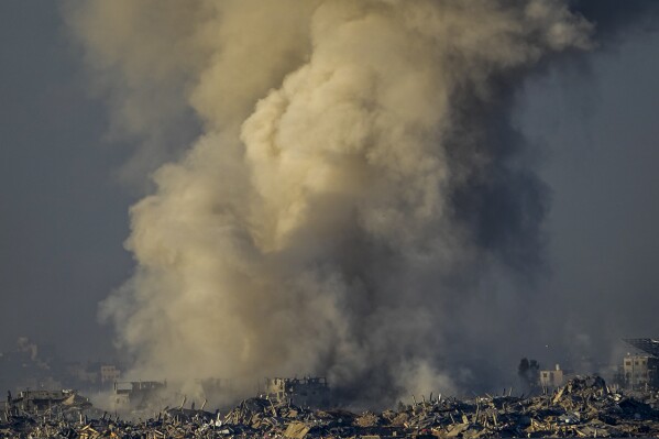 Smoke rises following an Israeli bombardment in the Gaza Strip, as seen from southern Israel, Saturday, Dec. 16, 2023. (AP Photo/Ariel Schalit)