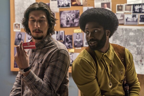 
              This image released by Focus Features shows Adam Driver, left, and John David Washington in a scene from "BlacKkKlansman." The film is nominated for an Oscar for best picture. The 91st Academy Awards will be held on Sunday. (David Lee/Focus Features via AP)
            