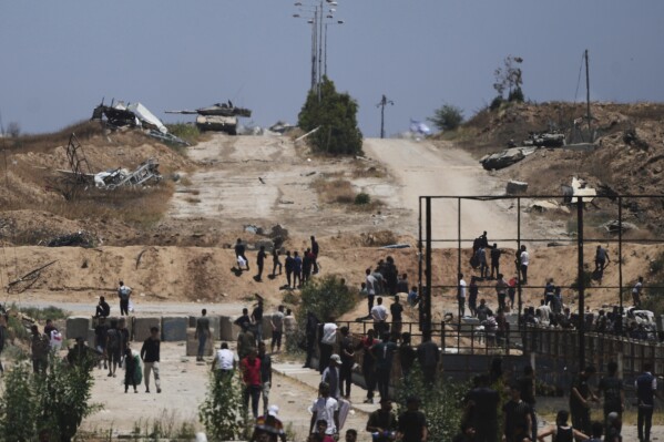 Live updates: Israel accepts plan for temporary Gaza ceasefire, US says |  AP News