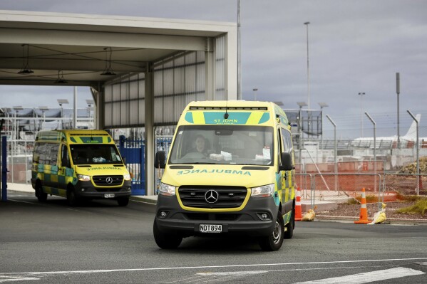 Ambulances leave Auckland International in Auckland, New Zealand, Monday, March 11, 2024. More than 20 people were injured after what officials described as a "technical event" on a Chilean plane traveling from Sydney, Australia, to Auckland. (Dean Purcell/New Zealand Herald via AP)