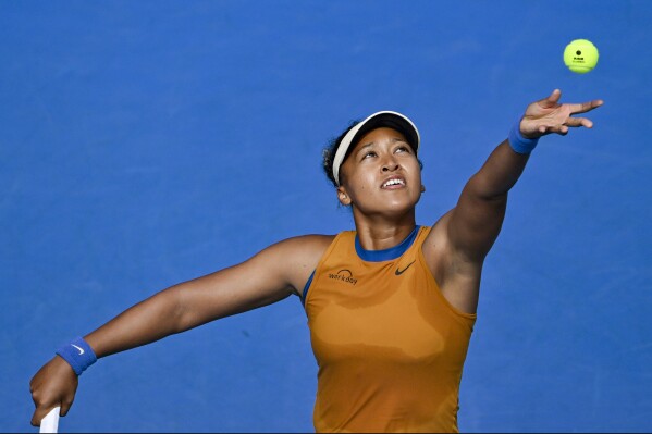 Namoi Osaka of Japan serves against Lina Glushko of Israel during a women's singles match at the ASB Classic tennis tournament at Manuka Doctor Arena in Auckland, New Zealand Monday, Dec. 30, 2024. (Alan Lee/Photosport via AP)