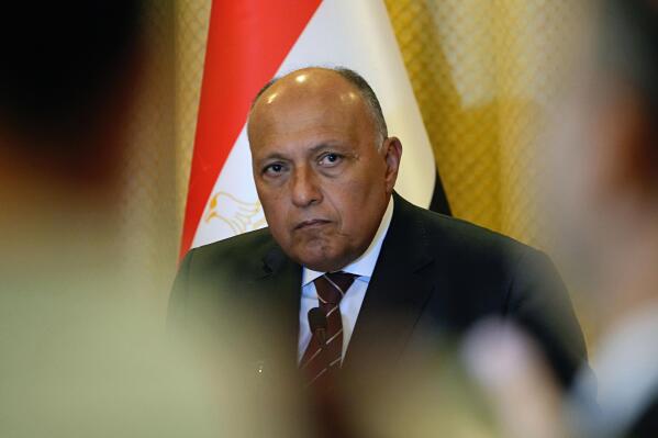 FILE - Egyptian Foreign Minister Sameh Shoukry, holds a press conference in Baghdad, Iraq, on June 6, 2022. Egypt’s foreign minister has urged world leaders and negotiators to deliver on previously made pledges to battle climate change ahead of this month’s U.N. summit. Sameh Shoukry is president of the COP27 climate change conference to be held in the Egyptian resort town of Sharm el-Sheikh on Nov. 6-18. (AP Photo/Hadi Mizban)