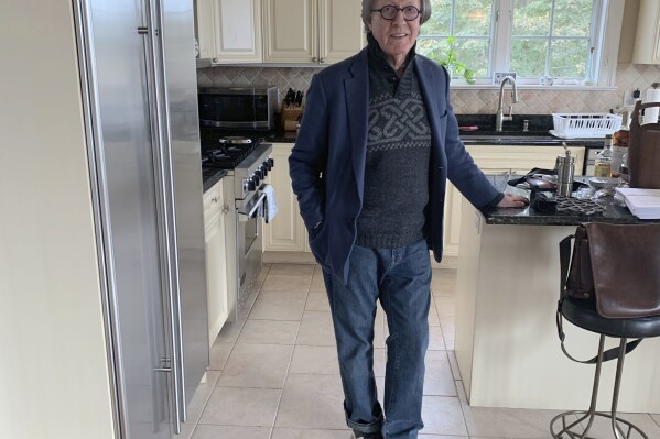 This undated photo provided by Jane Friedman shows Stephen Rubin posing for a picture in his kitchen in West Hampton, N.Y., Rubin, a longtime publishing executive with an eye for bestsellers and a passion for music and public life who helped launched the career of John Grisham, among others, and released such blockbusters as “The Da Vinci Code” and “Fire and Fury,” has died, Friday, Oct. 13, 2023. He was 81. (Jane Friedman via AP)