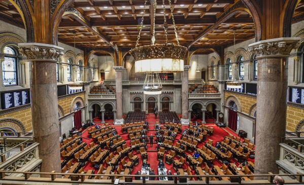 FILE - View of the New York state Assembly Chamber as members meet on the opening day of the 2021 legislative session at the state Capitol in Albany, N.Y. Wednesday, Jan. 6, 2021, in Albany, N.Y. A bipartisan commission tasked with redrawing New York's congressional districts has until Tuesday to agree on new boundaries — or risk having Democratic lawmakers seize control over a reapportionment process voters hoped would minimize gerrymandering. (AP Photo/Hans Pennink, File)