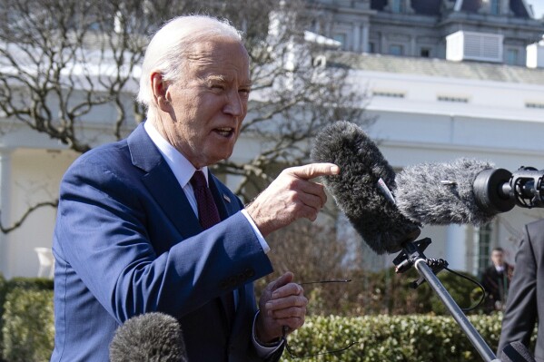 FILE - President Joe Biden talks with reporters before boarding Marine One on the South Lawn of the White House, Tuesday, Feb. 20, 2024, in Washington. Occupants of the White House have grumbled over news coverage practically since the place was built. Now it's Biden's turn: With a re-election campaign underway, there are signs that those behind the president are starting to more aggressively and publicly challenge how he is portrayed. (AP Photo/Evan Vucci, File)