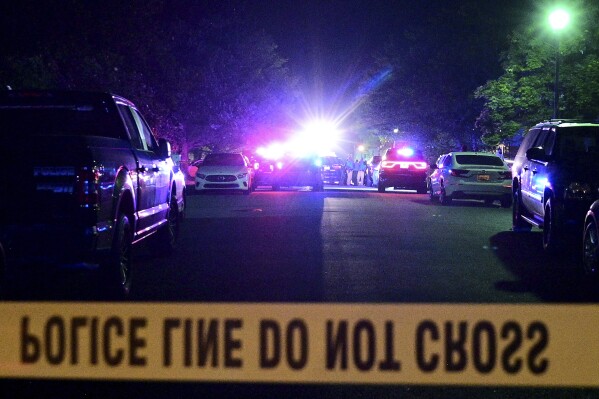 FILE - Paddington Place is shut down by police as multiple people were shot at a home on Paddington Place in Annapolis, Md., Sunday, June 11, 2023. A man has been charged with hate crimes in the shooting deaths of three people last month in Maryland's capital city the state capital after a dispute over parking that also resulted in three people being wounded. (Paul W. Gillespie/The Baltimore Sun via AP)