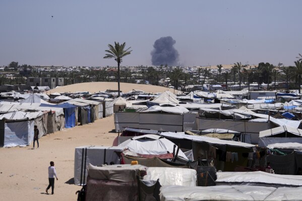 Smoke rises from an Israeli army airstrike south of Khan Younis, Gaza, Wednesday, May 21, 2025. (AP Photo/Abdel Kareem Hana)