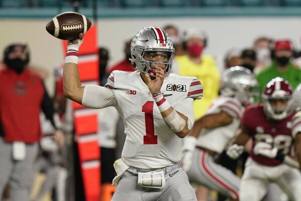 Ohio State quarterback Justin Fields passes against Alabama during the first half of an NCAA College Football Playoff national championship game, Monday, Jan. 11, 2021, in Miami Gardens, Fla. (AP Photo/Lynne Sladky)