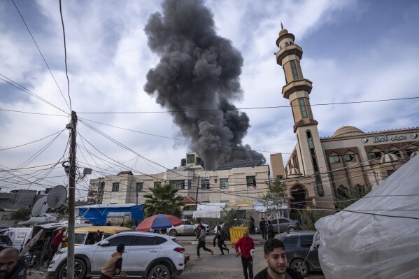 Smoke rises following an Israeli bombardment on Rafah, southern Gaza Strip, Wednesday, Dec. 20, 2023. (AP Photo/Fatima Shbair)