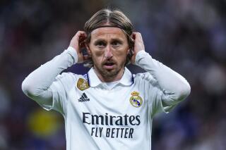 FILE - Real Madrid's Luka Modric gestures during Spanish La Liga soccer match between Real Madrid and Celta Vigo at the Santiago Bernabeu stadium in Madrid, Spain, Saturday, April 22, 2023. Real Madrid midfielder Luka Modric has injured his left thigh barely a week ahead of the Copa del Rey final and the Champions League semifinals, the Spanish club said Friday, April 28, 2023. (AP Photo/Manu Fernandez, File)
