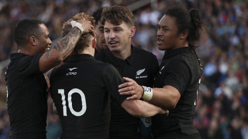 New Zealand's All Blacks Beauden Barred, center, celebrates scoring a try with teammates during a rugby championship match against Argentina's Los Pumas at Malvinas Argentinas stadium in Mendoza, Argentina, Saturday, July 8, 2023. (AP Photo/Nicolas Aguilera)