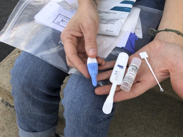 West Virginia. Caption: Solutions Oriented Addiction Response organizer Brooke Parker displays an HIV testing kit Tuesday, March 9, 2021, in Charleston, W.Va. The nonprofit group operates health fairs for residents, including syringe exchanges and HIV testing. (AP Photo/John Raby)