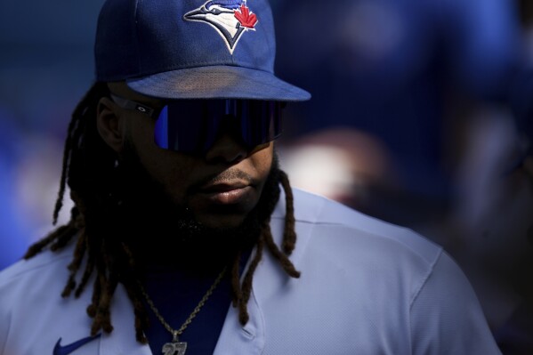 Toronto Blue Jays first baseman Vladimir Guerrero Jr. stands in the dugout before a baseball game against the Boston Red Sox in Toronto, Saturday, Sept. 16, 2023. (Chris Young/The Canadian Press via AP)