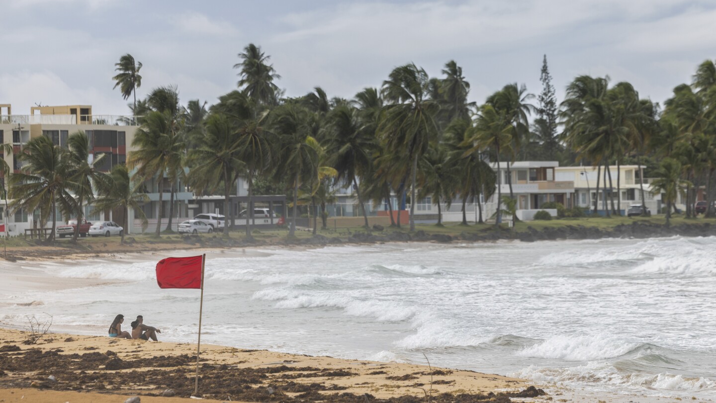 Tropical Hurricane Ernesto pummels northeast Caribbean and leaves masses of 1000’s in the dead of night