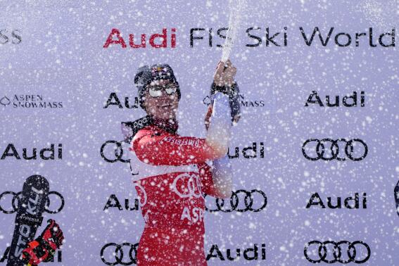 Switzerland's Marco Odermatt celebrates a first place finish in a men's World Cup super-G skiing race Sunday, March 5, 2023, in Aspen, Colo. (AP Photo/John Locher)