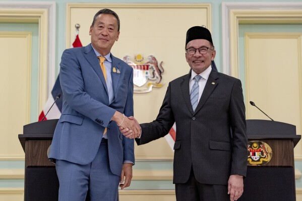 CORRECTS CITY - Thai Prime Minister Srettha Thavisin, shakes hands with Malaysia's Prime Minister Anwar Ibrahim on the occasion of Thavisin's official visit to Malaysia, in Kuala Lumpur, Wednesday, Oct. 11, 2023. (Afiq Hambali/Prime Minister’s Office of Malaysia via AP)