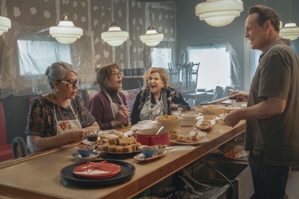 This image released by Netflix shows Lorraine Bracco, Talia Shire, Brenda Vaccaro and Vince Vaughn in a scene from "Nonnas." (Jeong Park/Netflix via AP)