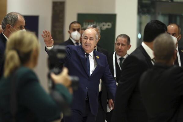 Algerian President Abdelmadjid Tebboune, center, arrives to attend the Arab Summit in Algiers, Algeria, Tuesday, Nov. 1, 2022. Arab leaders are meeting in Algeria at the 31st summit of the largest annual Arab conference to seek common ground on divisive issues in the region. The meeting comes against the backdrop of rising inflation, food and energy shortages, drought and soaring cost of living across the Middle East and Africa. (AP Photo/Anis Belghoul)