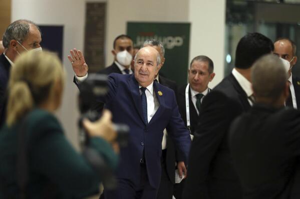 Algerian President Abdelmadjid Tebboune, center, arrives to attend the Arab Summit in Algiers, Algeria, Tuesday, Nov. 1, 2022. Arab leaders are meeting in Algeria at the 31st summit of the largest annual Arab conference to seek common ground on divisive issues in the region. The meeting comes against the backdrop of rising inflation, food and energy shortages, drought and soaring cost of living across the Middle East and Africa. (AP Photo/Anis Belghoul)