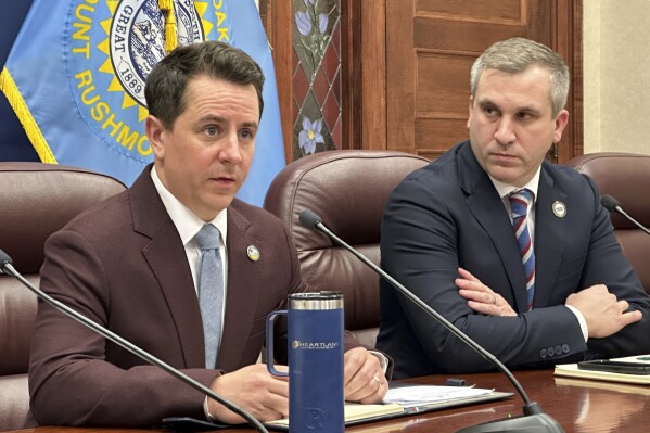 South Dakota Republican House Majority Leader Will Mortenson, at left, and Republican Senate Majority Leader Casey Crabtree, at right, appear at a press conference at the state Capitol in Pierre, S.D., on Thursday, Feb. 22, 2024. The Republican-led Legislature overwhelming approved a resolution officially opposing a proposed ballot initiative that would place abortion rights in the South Dakota Constitution. AP Photo/Jack Dura