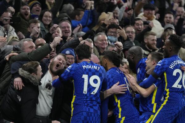 Chelsea players celebrate with their fans after Chelsea's Thiago Silva scored their side's second goal during the English Premier League soccer match between Chelsea and Tottenham Hotspur at Stamford Bridge stadium in London, England, Sunday, Jan. 23, 2022. (AP Photo/Kirsty Wigglesworth)