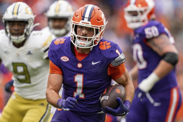 FILE - Clemson running back Will Shipley carries against Georgia Tech during the first half of an NCAA college football game Nov. 11, 2023, in Clemson, S.C. Shipley is giving up his college eligibility to enter the NFL draft. Shipley announced his decision on social media Wednesday nigh, Jan. 3. (AP Photo/Jacob Kupferman, File)
