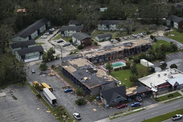 FILE - Debris is littered around the damaged Regency Inn Perry in Perry, Fla., following the passage of Hurricane Idalia, Wednesday, Aug. 30, 2023. (AP Photo/Rebecca Blackwell, File)