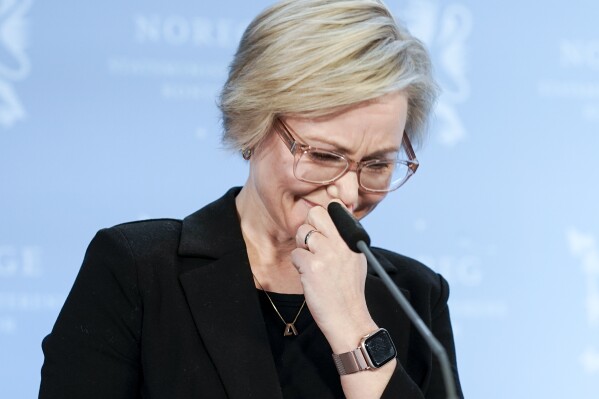 Norwegian Minister of Health and Care Ingvild Kjerkol sobs during a press conference at the Prime Minister's office SMK in Oslo, Norway, Friday April 12, 2024. Norway’s health minister resigned Friday, the second Norwegian government member to step down this year amid allegations they plagiarized academic works. (Cornelius Poppe/NTB Scanpix via AP)