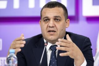 FILE - In this Tuesday, Oct. 27, 2020, file photo, Umar Kremlev, General Secretary of the Russian Boxing Federation and member of the Executive Committee of the International Boxing Association (AIBA), speaks during a news conference in Moscow, Russia. In a news conference, Monday, June 28, 2021, Kremlev said he is confident his beleaguered organization will be welcomed back into the Olympic family after the Tokyo Games. (AP Photo/Alexander Zemlianichenko, File)
